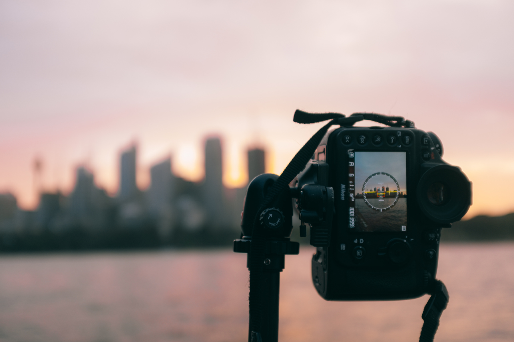 Black Dslr Camera on Tripod